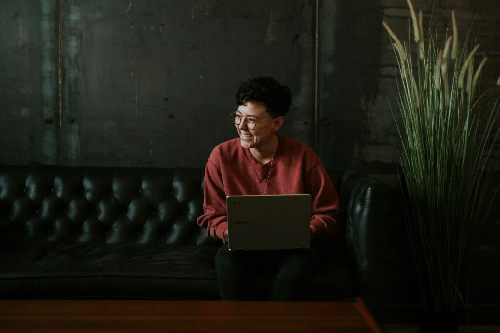 Person smiling while typing on keyboard