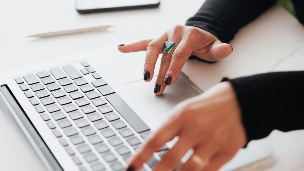Woman typing on laptop